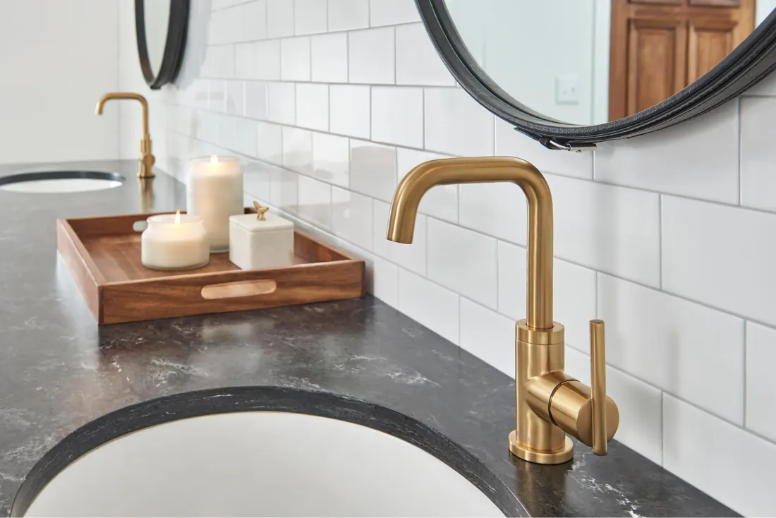 Finished bathroom with coordinated plumbing fixtures